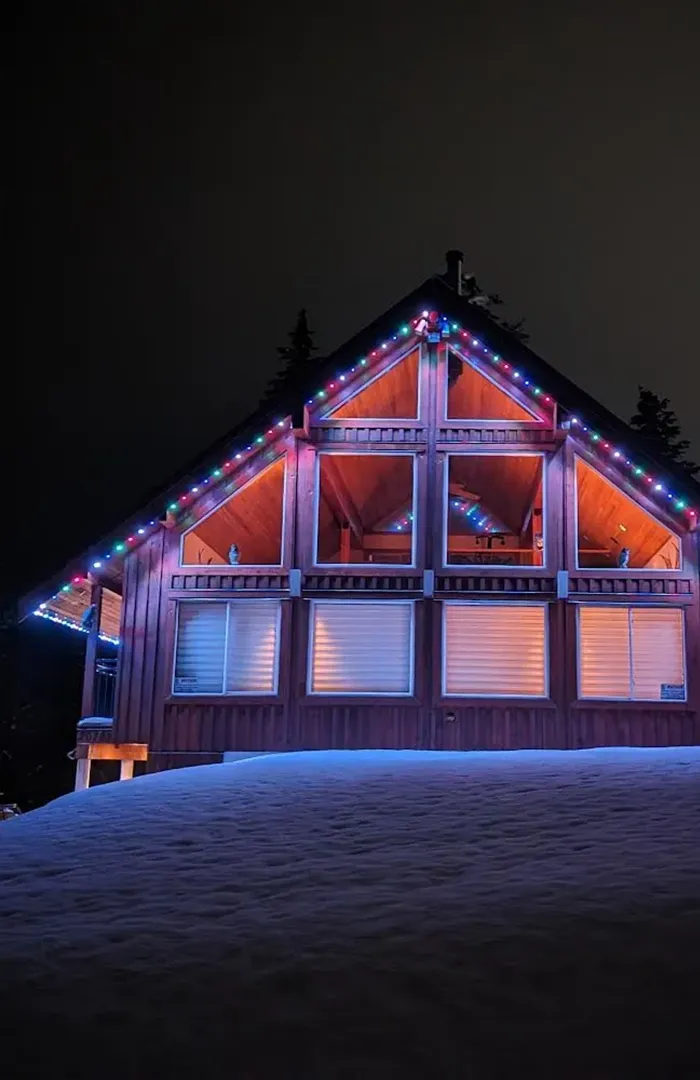 Invisible LED permanent holiday lights installed on a Vancouver home roofline.